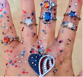 fairybath_jewel_child UGC image of hand with America collection rings